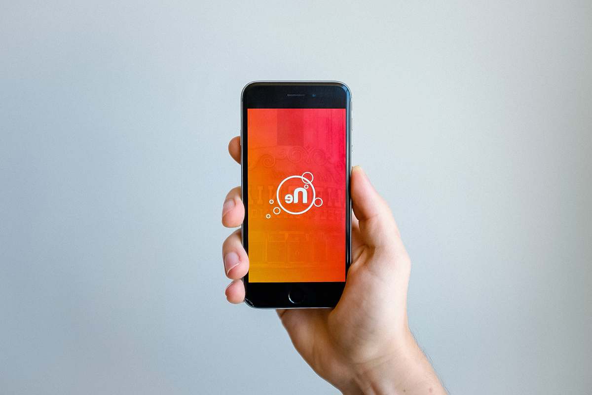 mobile phone person holding space gray iPhone 6 app